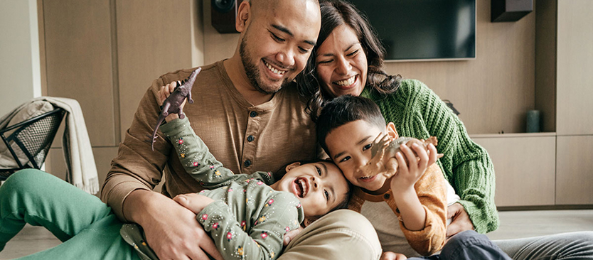 family with children looking happy