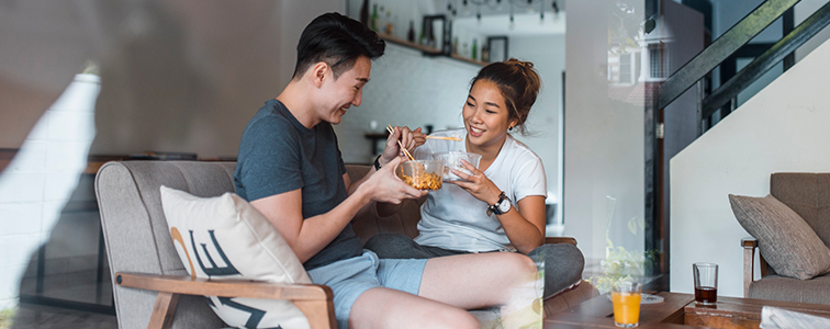 Young couple enjoying a meal together