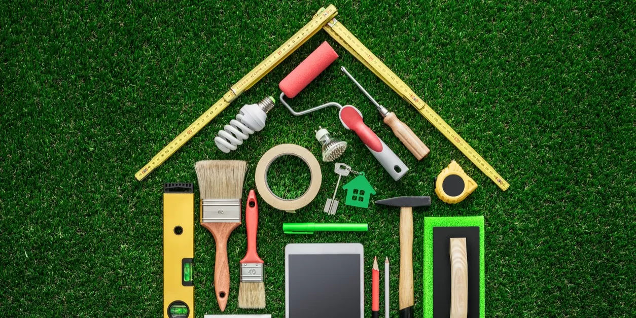 home maintenance items arranged to resemble a house